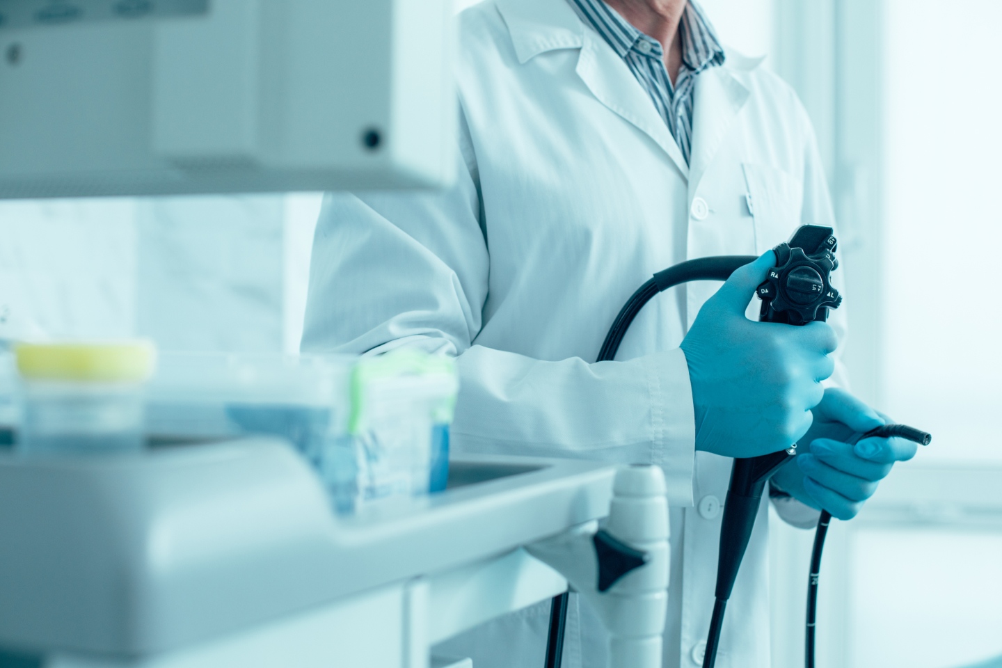 Man in a white coat working in a medical lab