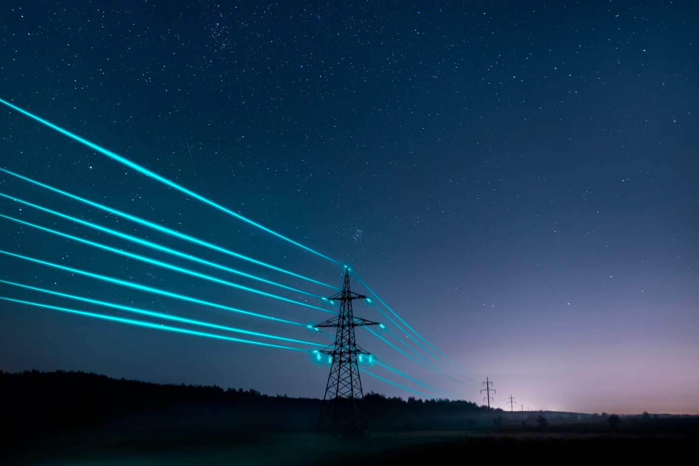 Powerlines lit up in the dark