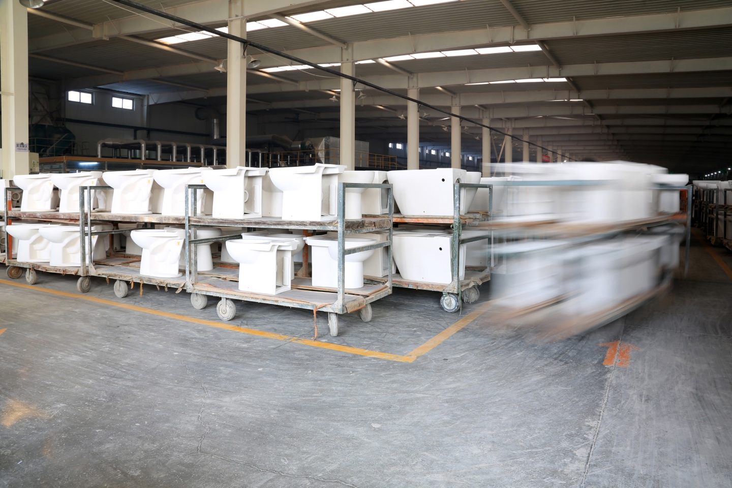 Toilets and other bathroom appliances being stored to represent investment in Reece