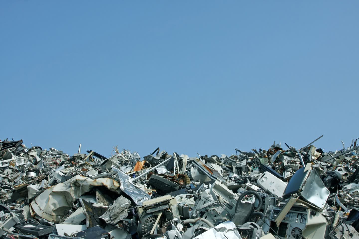 A clear sky and a horizon made up of scrap metal trash representing Sims