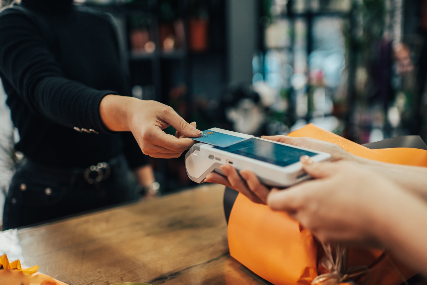 Person tapping to pay to represent Block who are beyond Square and Cashapp and other payment methods
