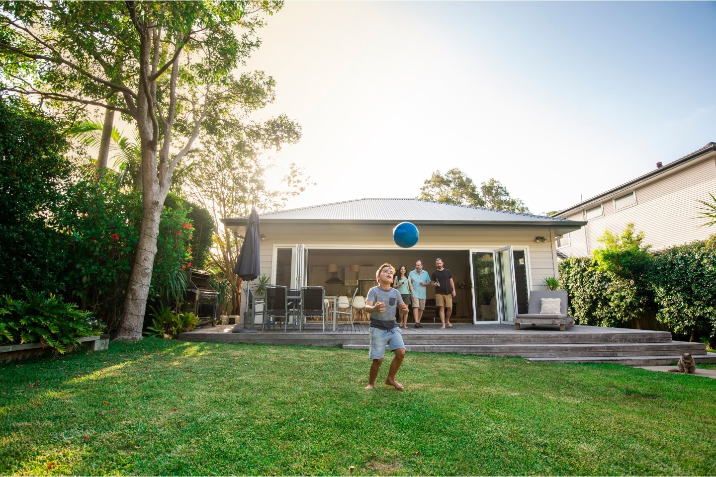 Kid playing in a backyard representing Suncorp