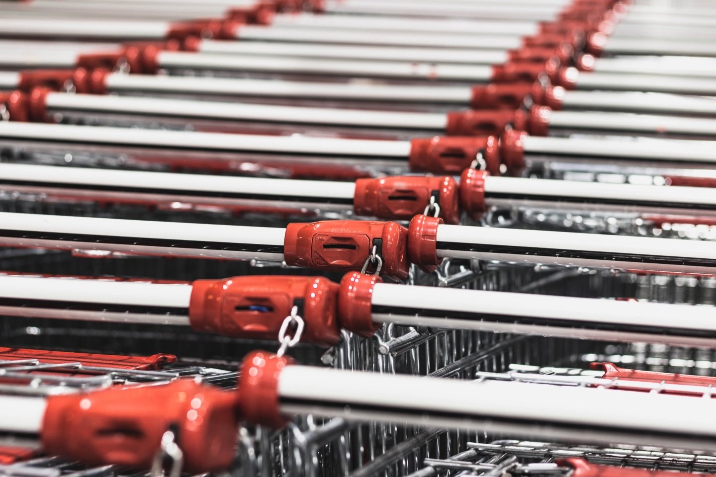 Supermarkets represented by chained up shopping trolley