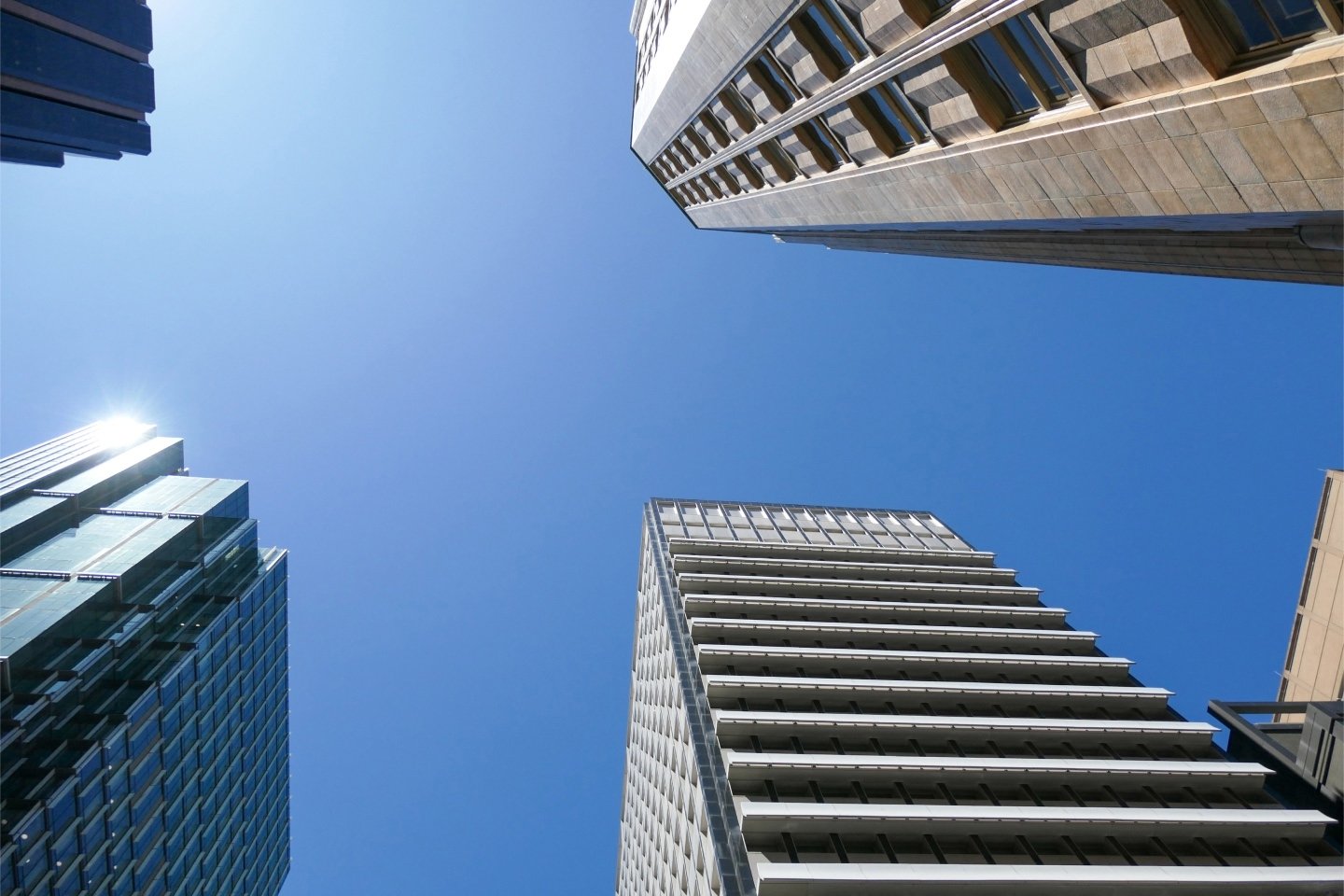 Skyscrapers in the central business district against a blue sky