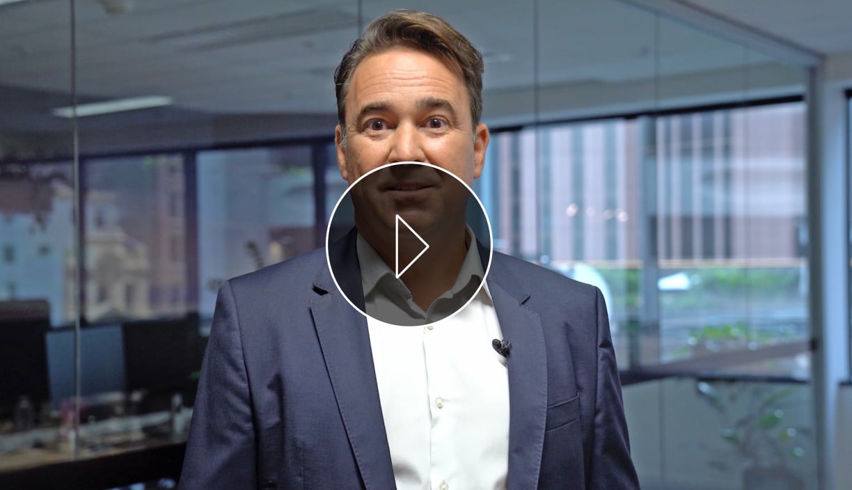 Nathan Parkin, Australian Ethical's Head of Equities, in front of an office, in a still from a video talking about Aussie Equities