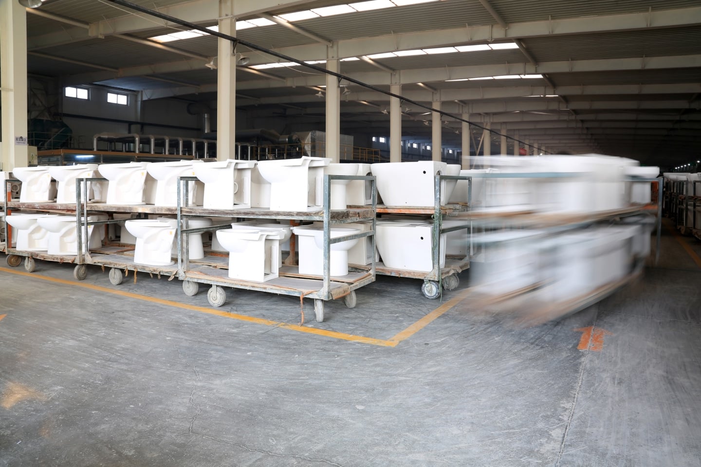 Toilets and other bathroom appliances being stored to represent investment in Reece