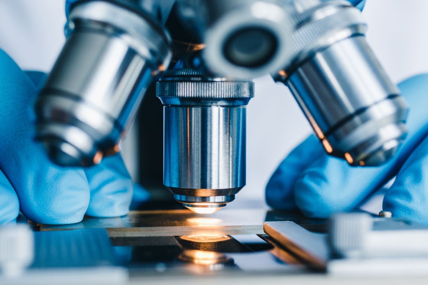 Microscope being used to look at medical samples in a lab