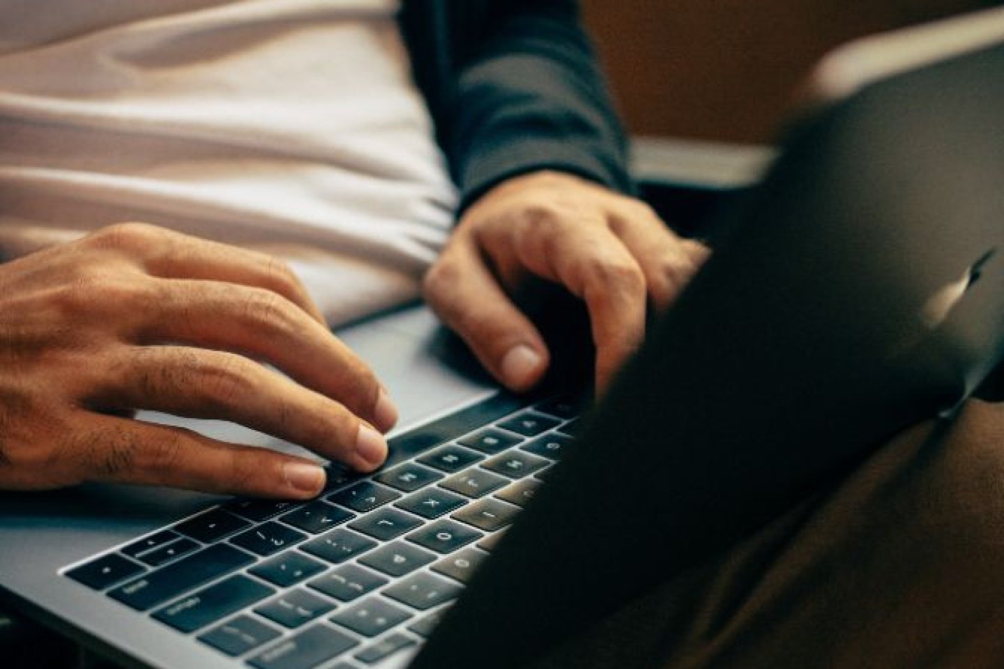 Man browsing his bank details online to see their position on climate change